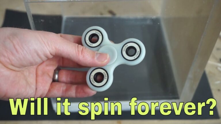 How do fidget spinners spin for so long?