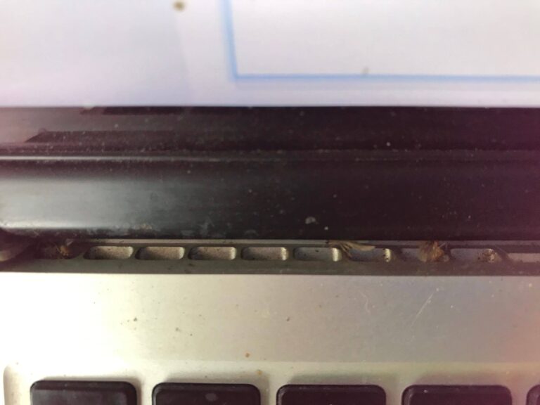 How do I clean my MacBook vents?