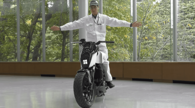 How does a motor bike stay upright?