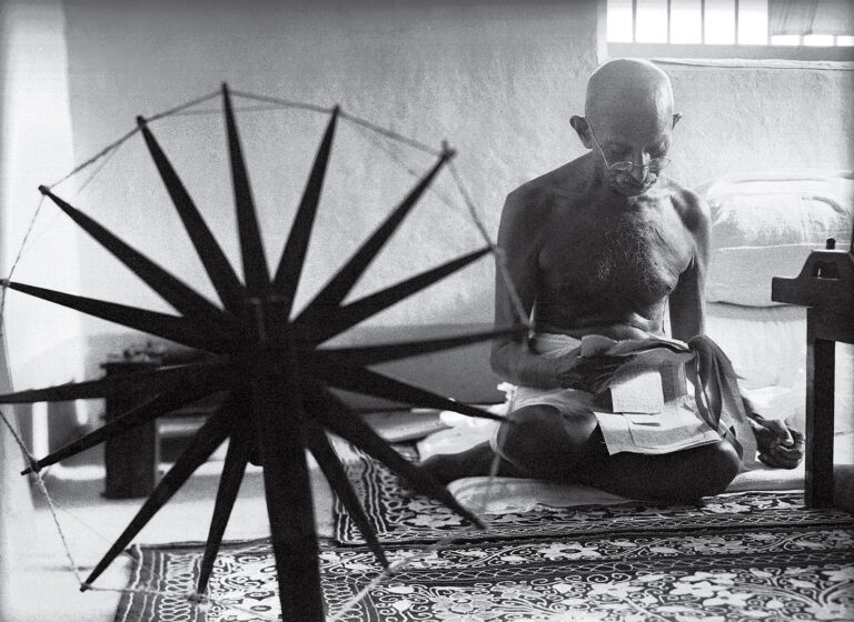 Why did Gandhi spin his own clothes?