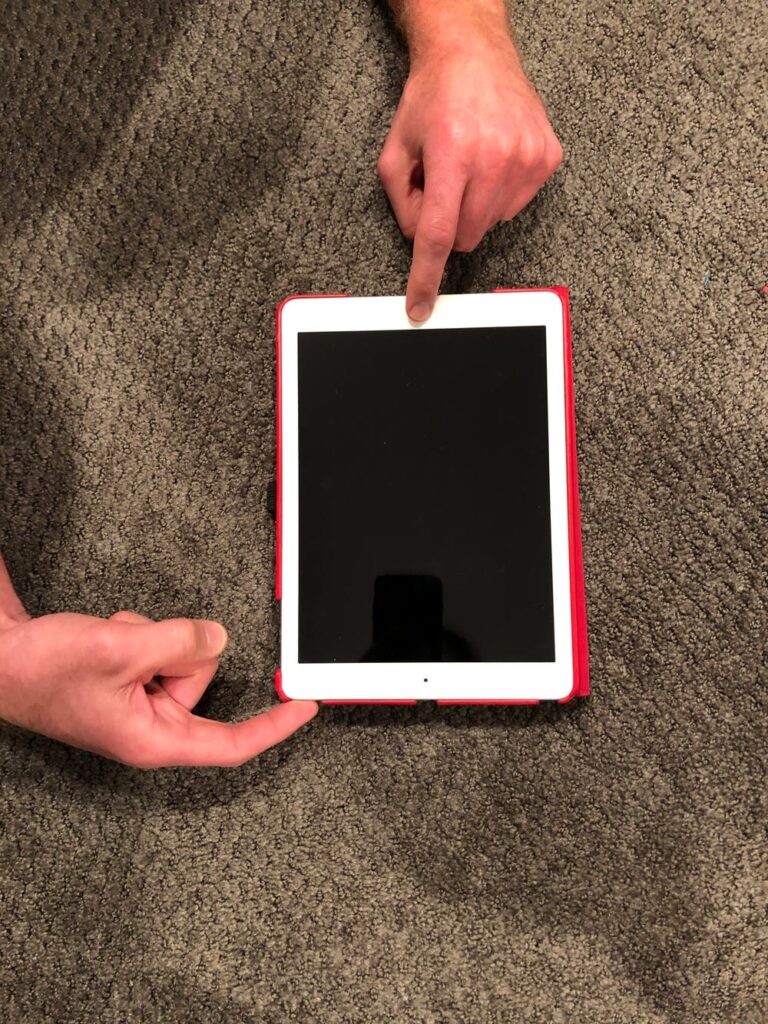 Why is my iPad stuck on a black screen?